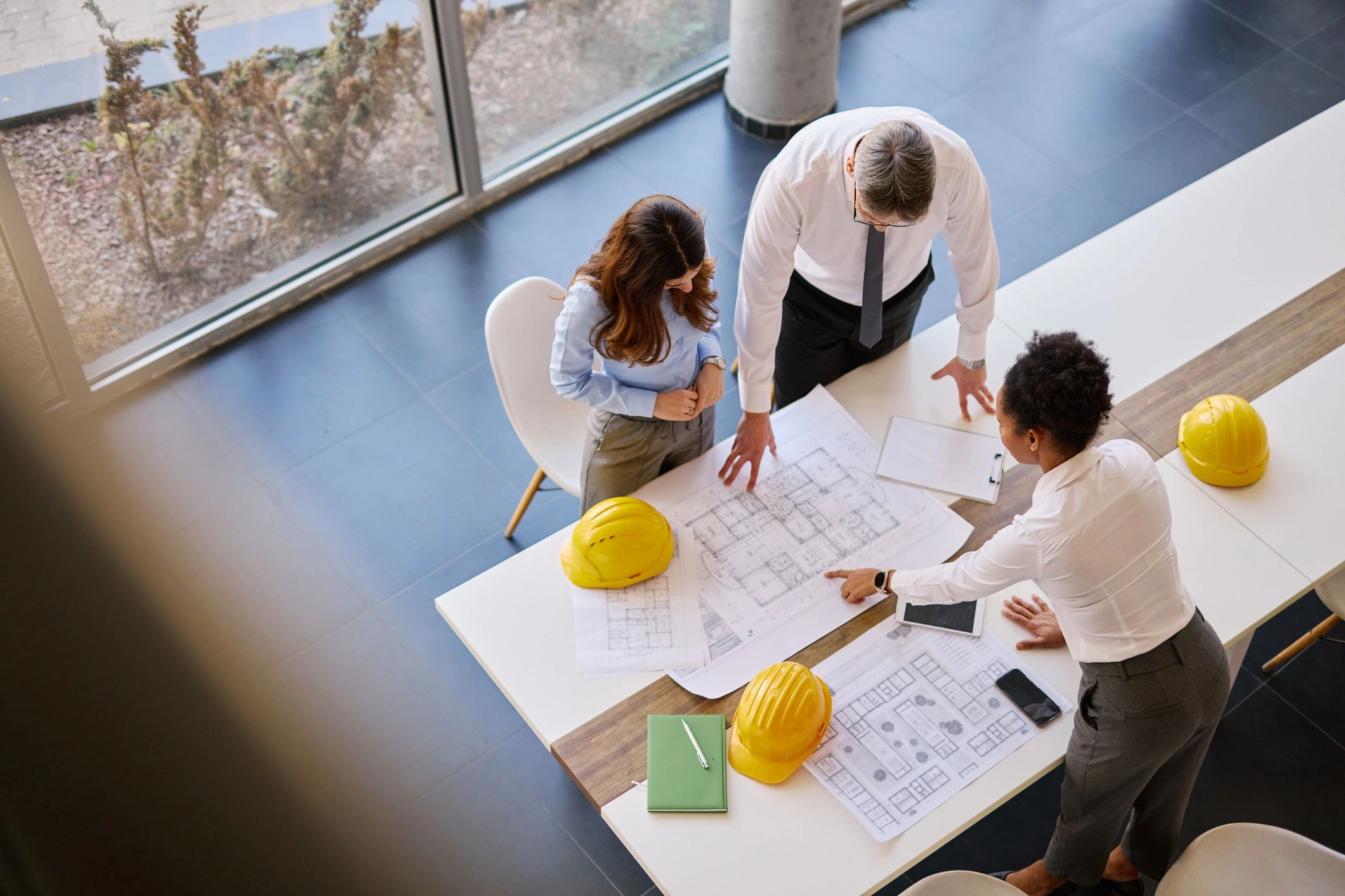 Professionals discussing strategy around a planning table